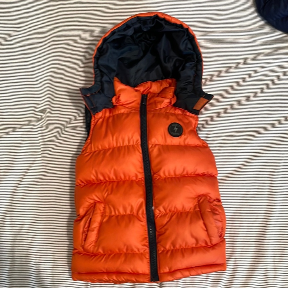Orange puffer vest, never used/ no tags